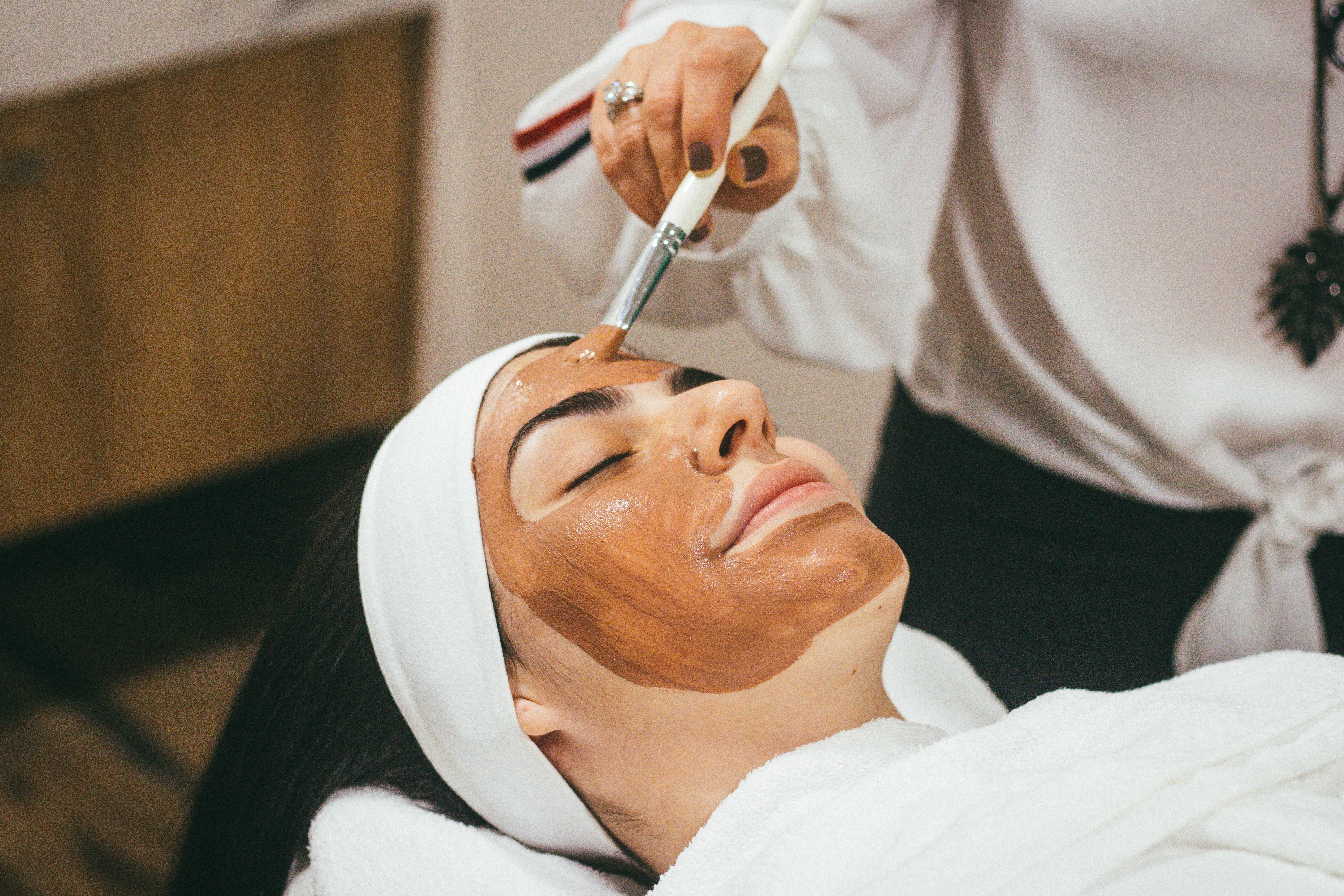 woman with a mud face mask