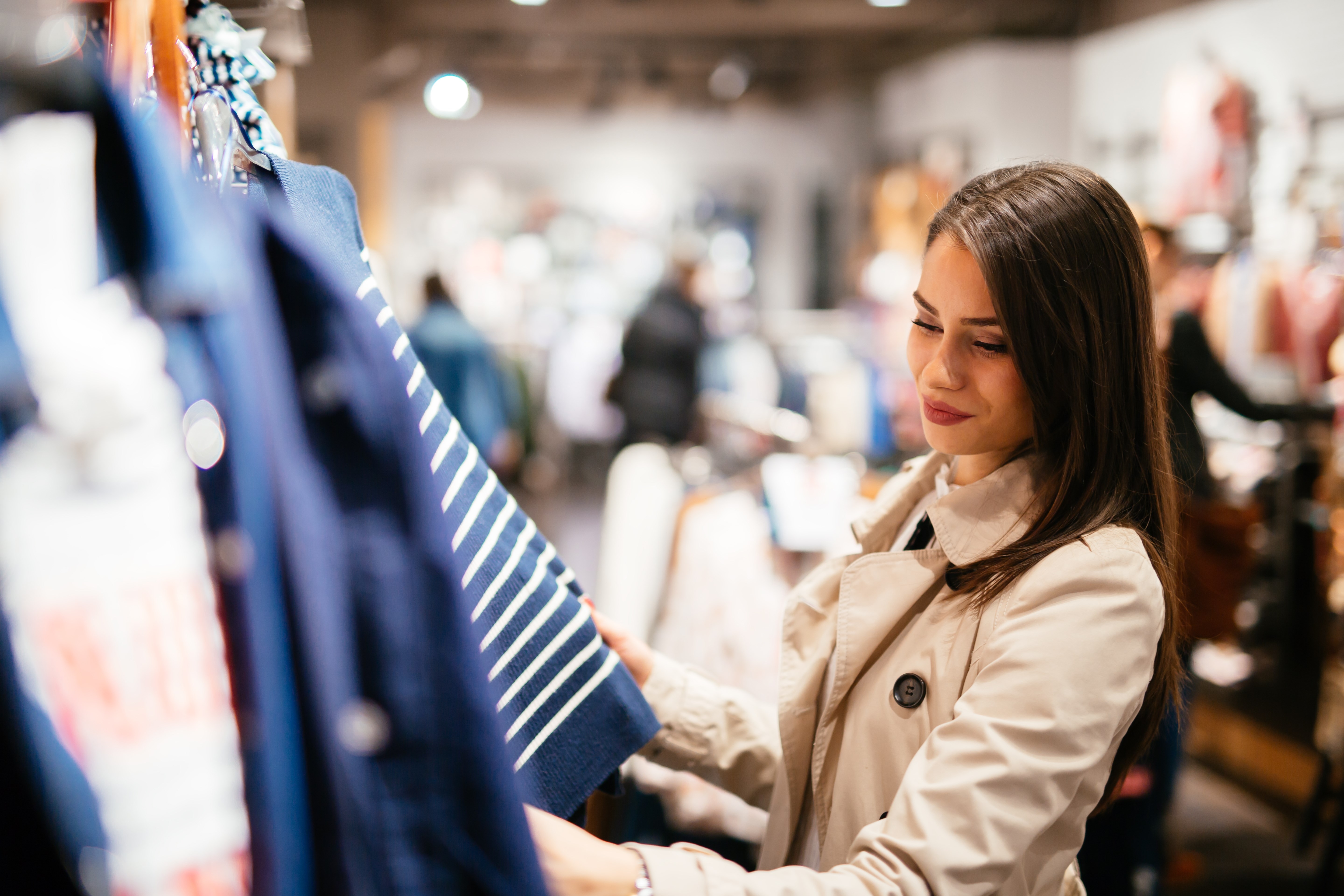 Beautiful businesswoman buying clothes